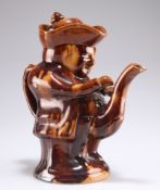 A 19TH CENTURY TREACLE-GLAZED TOBY TEAPOT