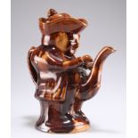 A 19TH CENTURY TREACLE-GLAZED TOBY TEAPOT