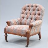 A VICTORIAN WALNUT AND UPHOLSTERED ARMCHAIR