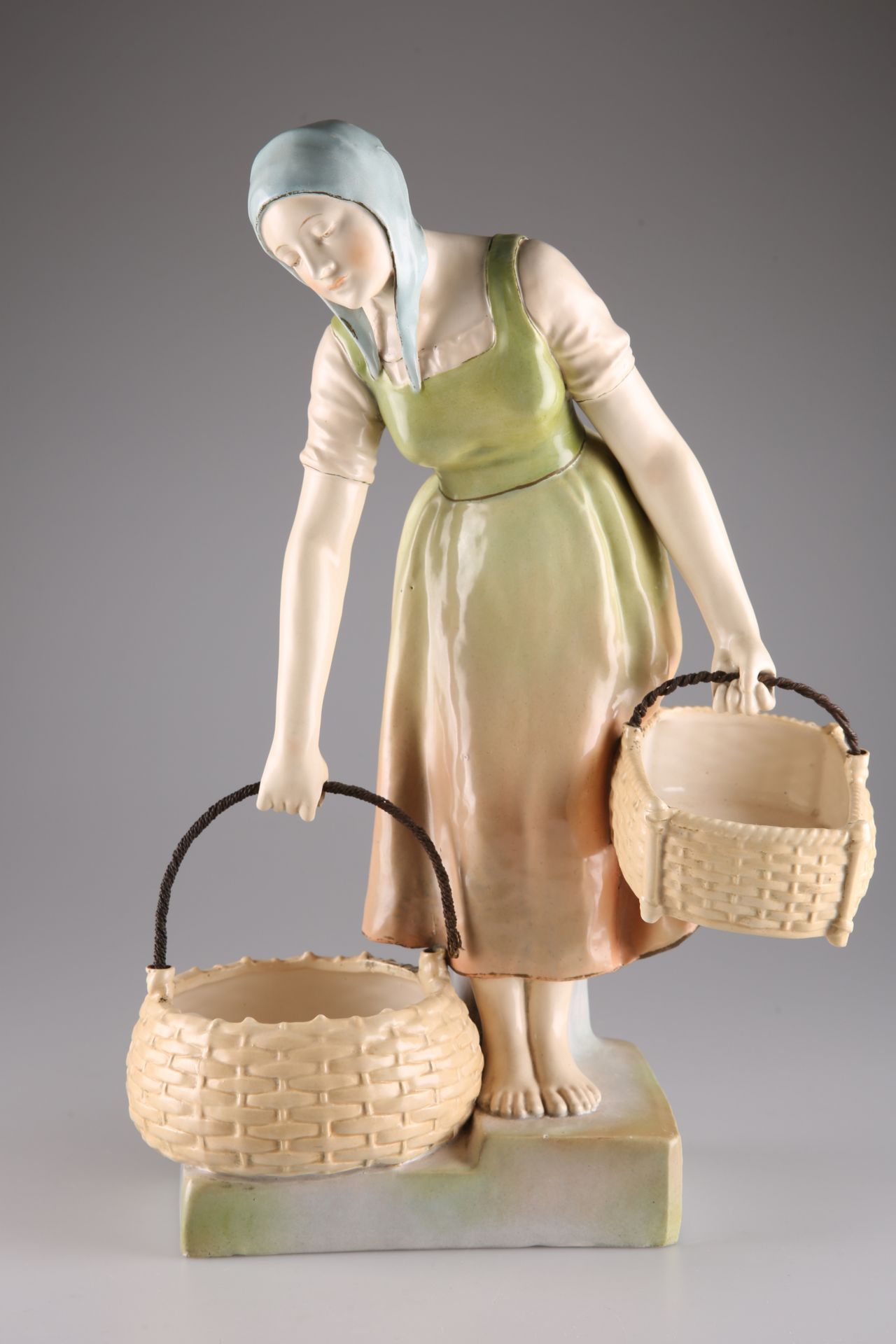 A LARGE AUSTRIAN FIGURE OF A GIRL WITH TWO BASKETS