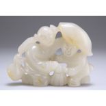 A CHINESE CARVED AND PIERCED PALE JADE FIGURE GROUP