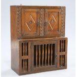 A VICTORIAN CARVED OAK FOOD HUTCH