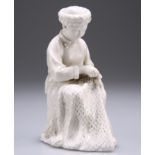 A BLANC DE CHINE FIGURE OF A SEATED WOMEN REPAIRING A FISHING NET