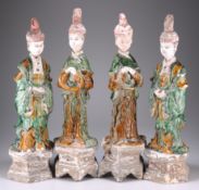 FOUR MING SANCAI GLAZED POTTERY FIGURES