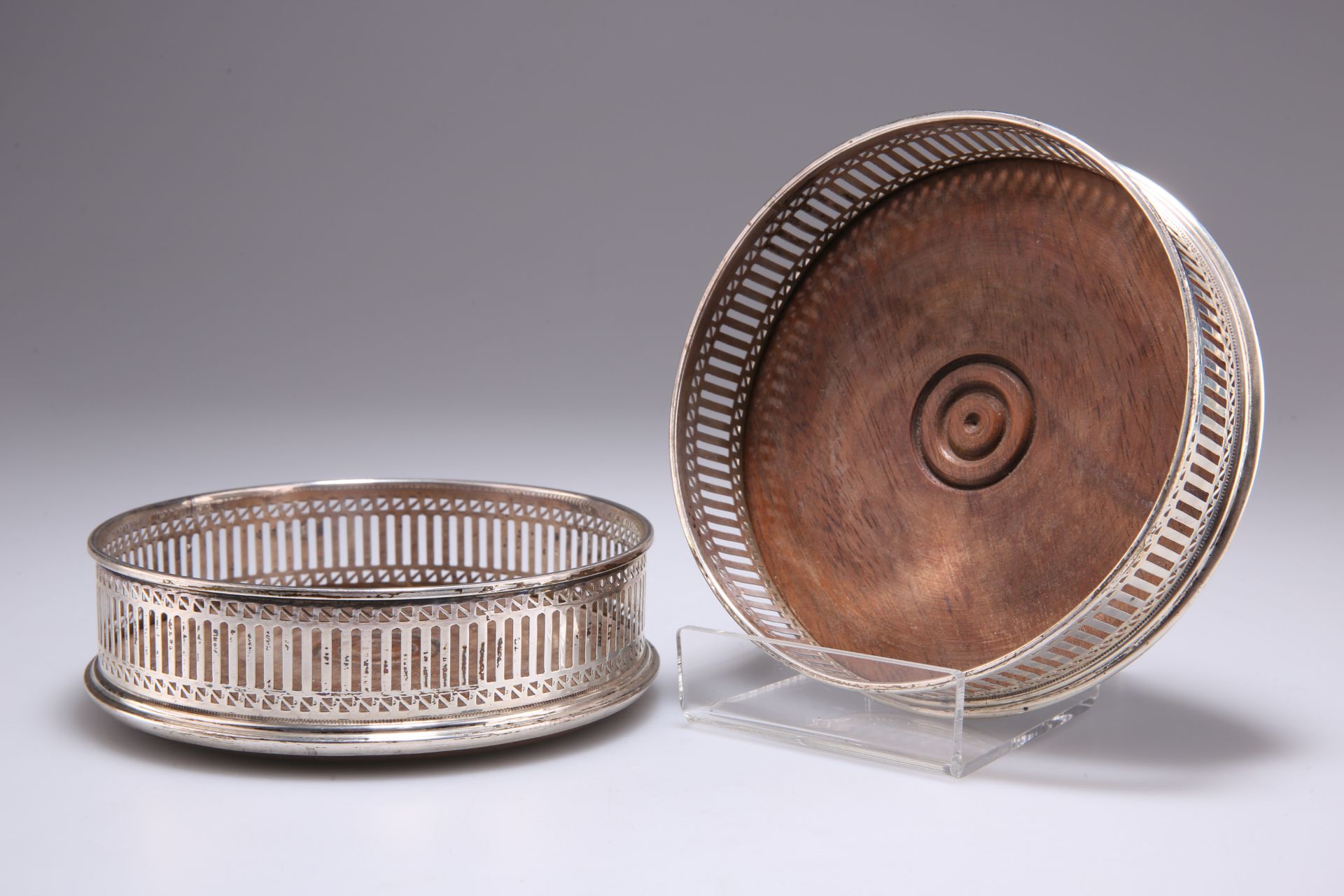 A PAIR OF GEORGE III STYLE SILVER WINE COASTERS
