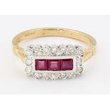 AN 18CT GOLD RUBY AND DIAMOND CLUSTER RING