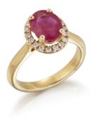 AN 18CT GOLD RUBY AND DIAMOND CLUSTER RING