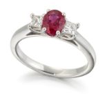 A PLATINUM RUBY AND DIAMOND THREE STONE RING