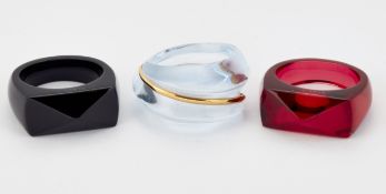 THREE BACCARAT COLOURED GLASS RINGS