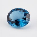 A LOOSE OVAL-CUT BLUE TOPAZ, 36.64 CARAT