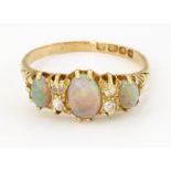 AN 18CT GOLD OPAL AND DIAMOND RING