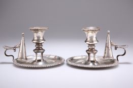 A PAIR OF GEORGE IV SILVER CHAMBERSTICKS