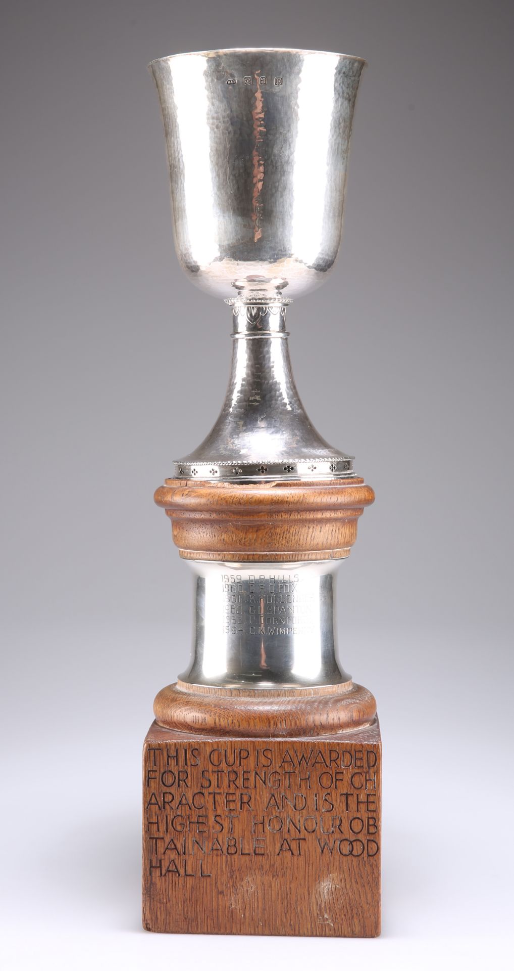 A BRITANNIA SILVER TROPHY CUP ON A MOUSEMAN OAK STAND