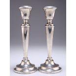 A PAIR OF ELIZABETH II SILVER CANDLESTICKS