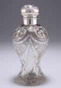 AN EDWARDIAN SILVER-MOUNTED CUT-GLASS SCENT BOTTLE