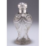 AN EDWARDIAN SILVER-MOUNTED CUT-GLASS SCENT BOTTLE