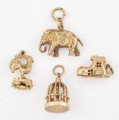 THREE 9CT GOLD CHARMS AND AN ELEPHANT CHARM