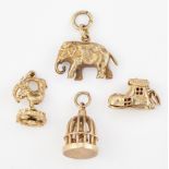 THREE 9CT GOLD CHARMS AND AN ELEPHANT CHARM