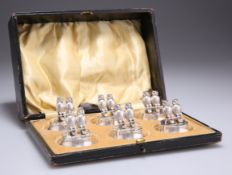 A SET OF SIX EDWARDIAN SILVER NOVELTY MENU HOLDERS