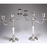 A PAIR OF GEORGE III SILVER AND OLD SHEFFIELD PLATE THREE-LIGHT CANDELABRA