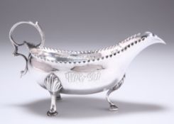 A GEORGE III SILVER CREAM BOAT