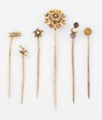 A GROUP OF SIX STICK PINS