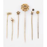 A GROUP OF SIX STICK PINS