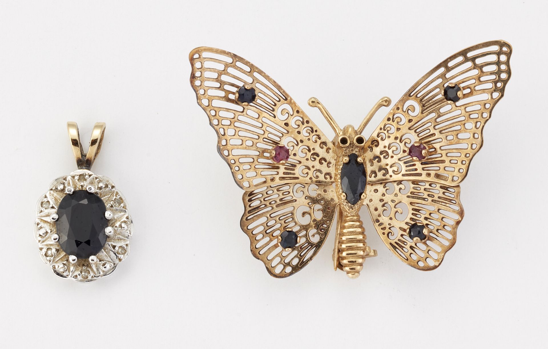 A 9CT GOLD SAPPHIRE AND RUBY BUTTERFLY BROOCH