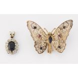 A 9CT GOLD SAPPHIRE AND RUBY BUTTERFLY BROOCH