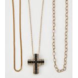 A 9CT GOLD BLACK AND WHITE DIAMOND SET CROSS PENDANT ON CHAIN