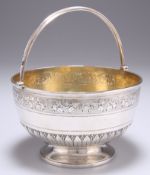 A VICTORIAN SILVER SWING-HANDLE SUGAR BOWL