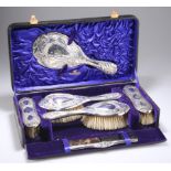 AN ART NOUVEAU SILVER-MOUNTED DRESSING TABLE SET