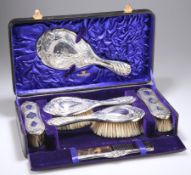 AN ART NOUVEAU SILVER-MOUNTED DRESSING TABLE SET