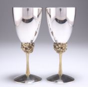 A PAIR OF ELIZABETH II PARCEL-GILT SILVER GOBLETS