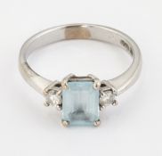 AN 18CT WHITE GOLD AQUAMARINE AND DIAMOND THREE STONE RING