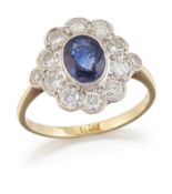 A SAPPHIRE AND DIAMOND CLUSTER RING