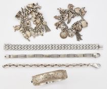 A GROUP OF SILVER BRACELETS