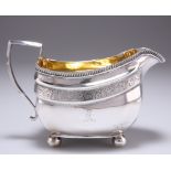 A GEORGE III SILVER CREAM JUG