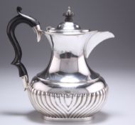 A VICTORIAN SILVER HOT WATER JUG