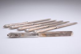 A SET OF SIX FABERGÉ CAST SILVER KNIVES