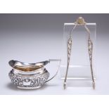 A MINIATURE SILVER CREAM JUG AND A PAIR OF SILVER GILT SUGAR NIPS