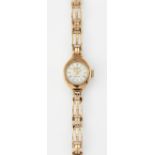 A LADY'S 9 CARAT GOLD ROTARY BRACELET WATCH