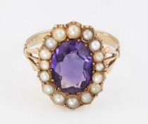 AN AMETHYST AND SPLIT PEARL CLUSTER RING