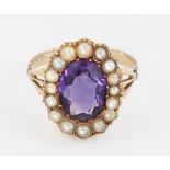 AN AMETHYST AND SPLIT PEARL CLUSTER RING