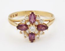 AN 18CT GOLD GARNET AND DIAMOND CLUSTER RING