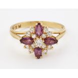 AN 18CT GOLD GARNET AND DIAMOND CLUSTER RING