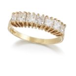 AN 18CT GOLD DIAMOND HALF HOOP RING