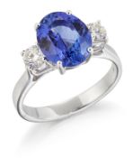 AN 18CT WHITE GOLD TANZANITE AND DIAMOND THREE STONE RING