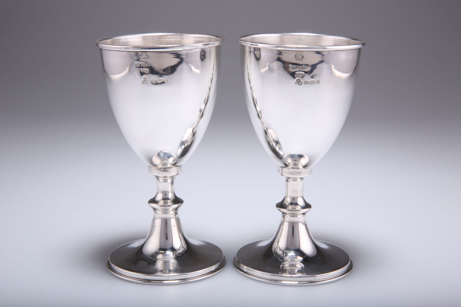 A PAIR OF ELIZABETH II SILVER IMPORT GOBLETS