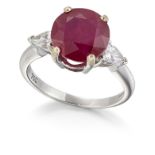 AN 18CT WHITE GOLD RUBY AND DIAMOND THREE STONE RING